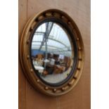 A 19TH CENTURY STYLE GILT FRAMED CONVEX MIRROR - 21" DIAMETER