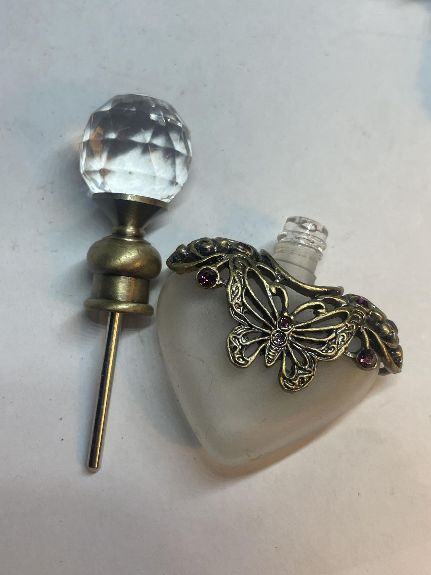 TWO GLASS PERFUME BOTTLES WITH METAL BUTTERFLY DESIGN - Image 4 of 4