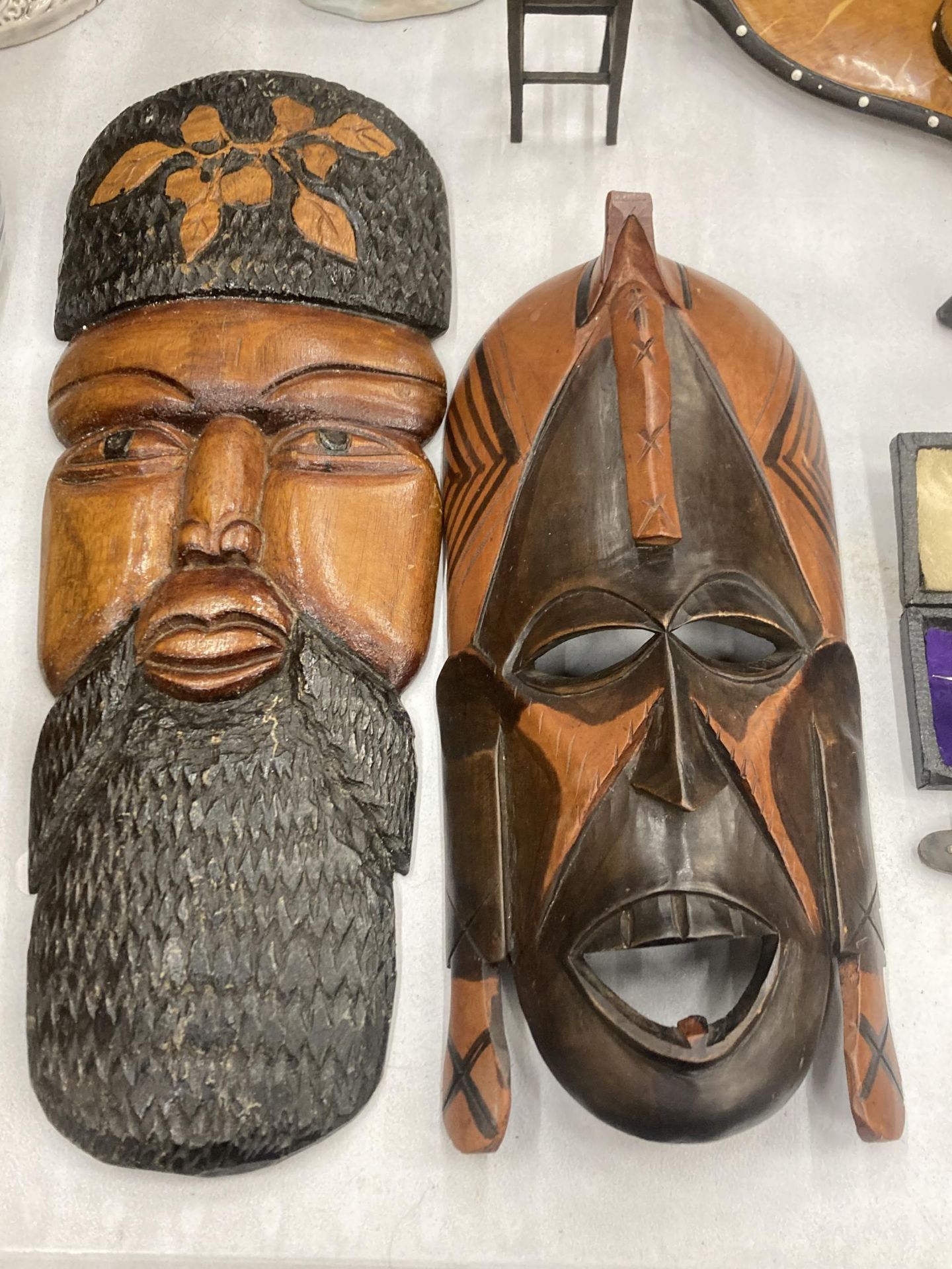 TWO TRIBAL WOODEN WALL MASKS