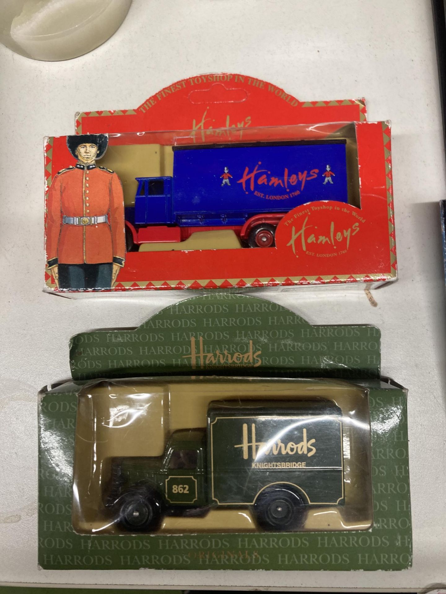 TWO BOXED LLEDO TRUCKS TO INCLUDE HAMLEYS AND HARRODS