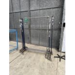 THREE HEAVY DUTY CLOTHES RAILS ON TROLLEY WHEELS