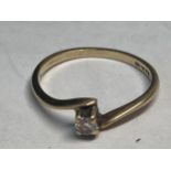 A 9 CARAT GOLD SOLITAIRE RING SIZE J/K