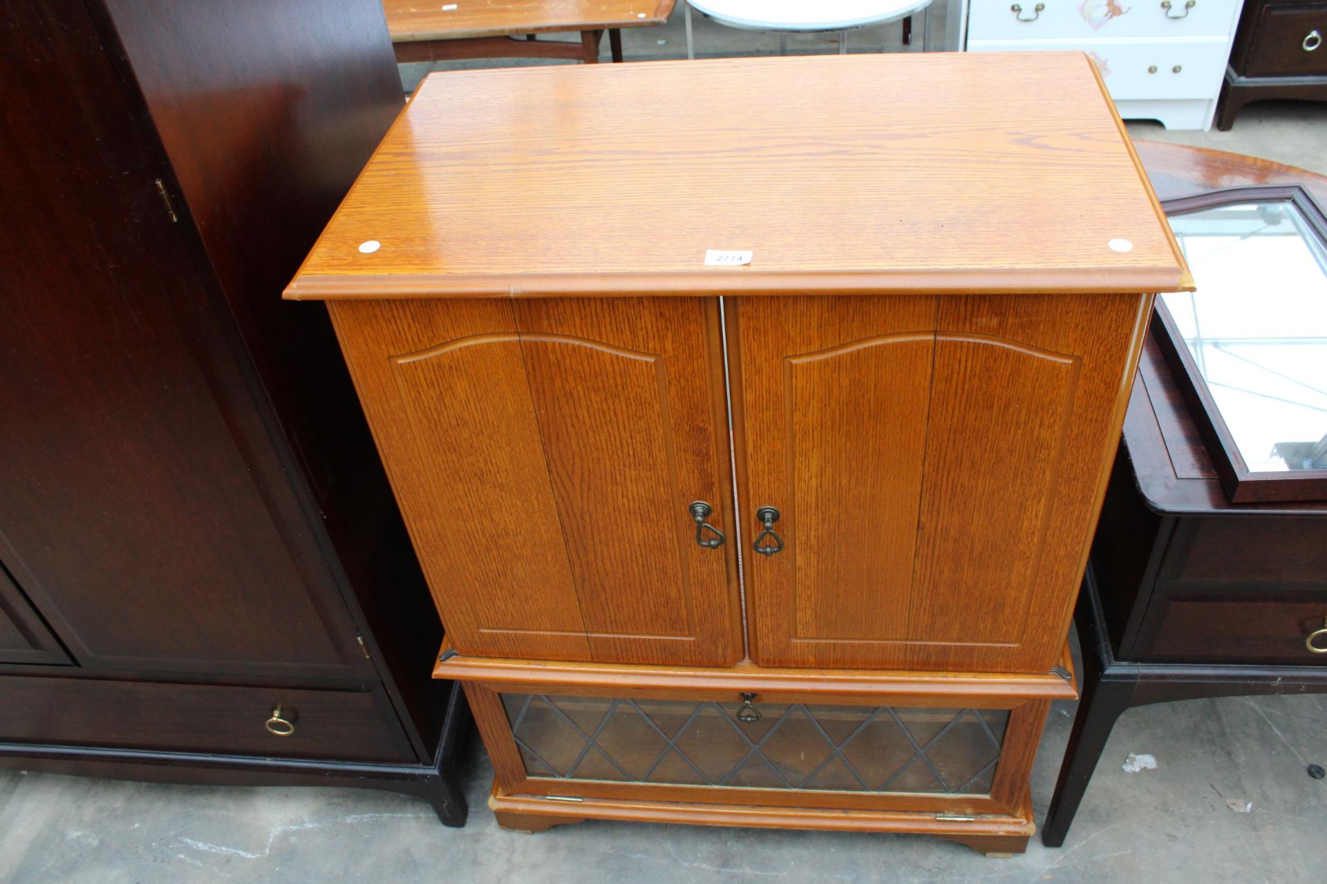 A MODERN CABINET WITH BIFOLD DOORS