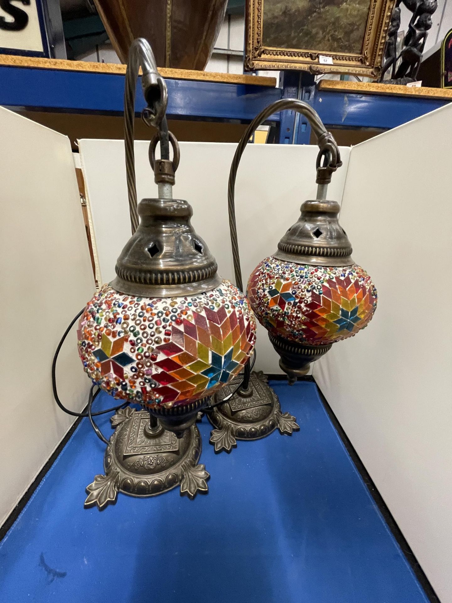 A PAIR OF MOROCCAN STYLE TABLE LAMPS WITH DECORATIVE GLASS SHADES