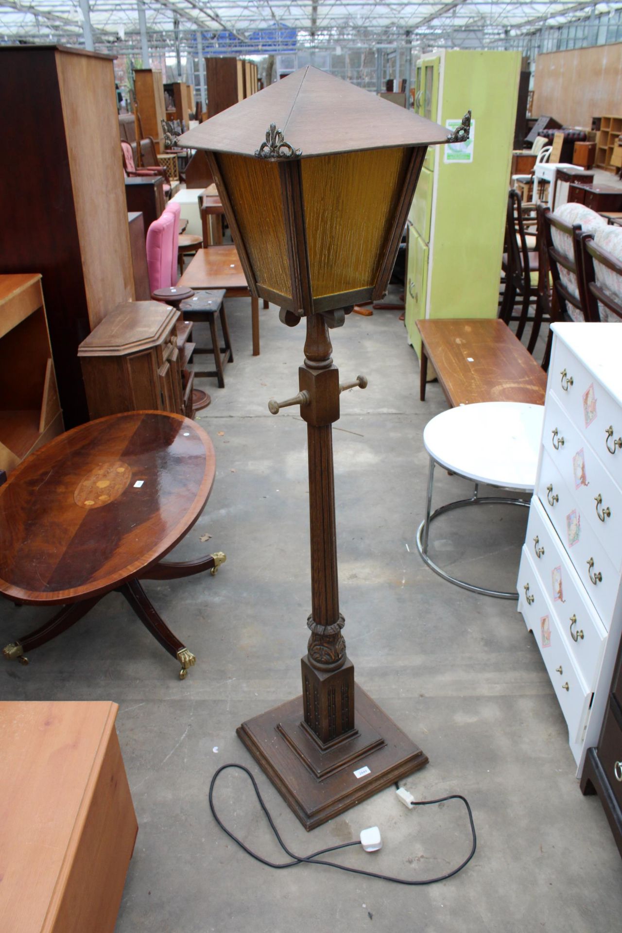 AN OAK STANDARD LAMP IN THE FORM OF A STREET LAMP