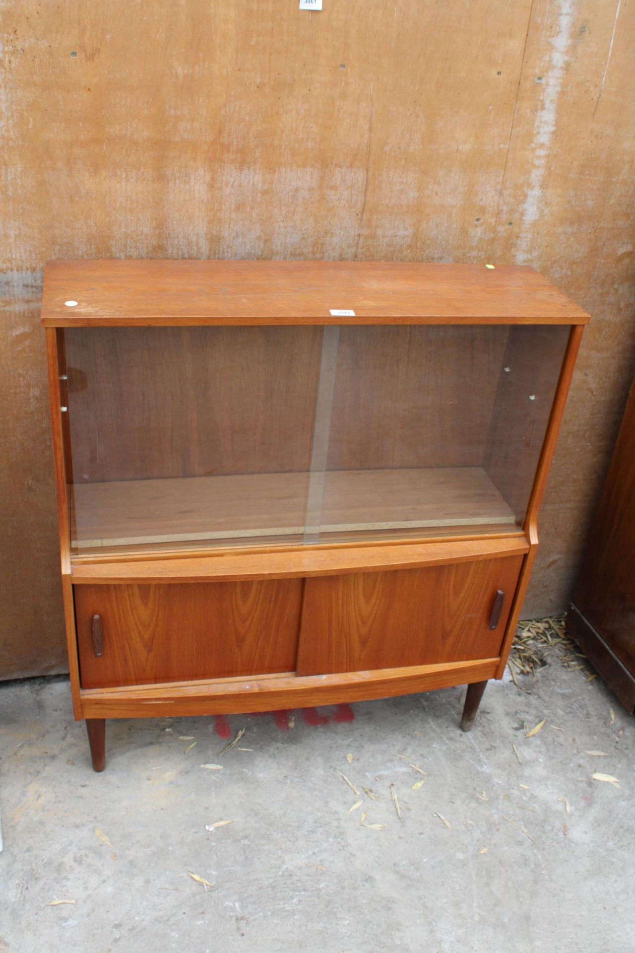 A RETRO TEAK DONCRAFT FURNITURE RETRO BOOKCASE WITH FOUR SLIDING DOORS, TWO BEING GLASS 36" WIDE
