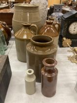 A COLLECTION OF STONEWARE TO INCLUDE FLAGONS TO INCLUDE C BUNTING, WINE AND SPIRIT MERCHANT,