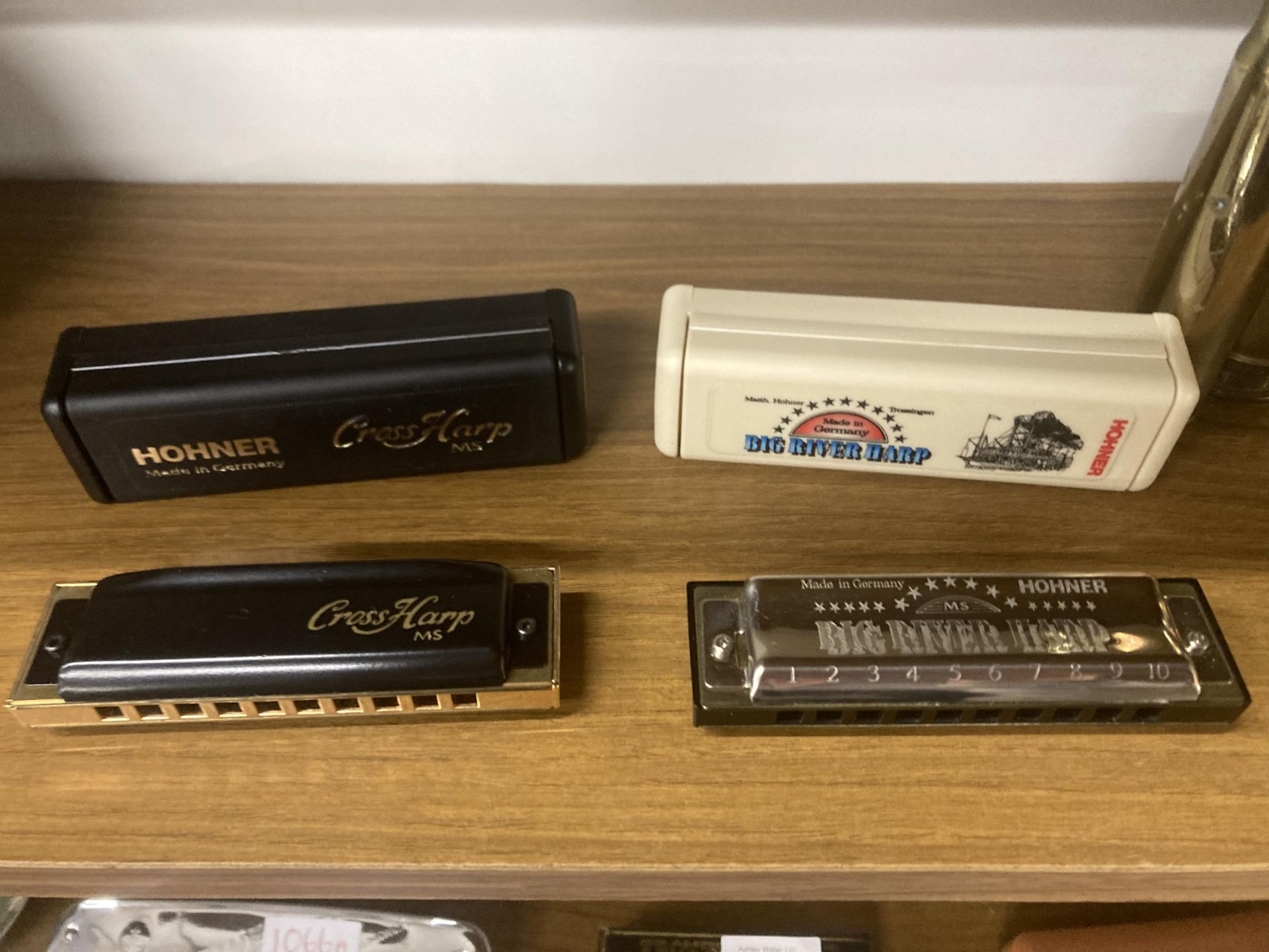 TWO HARMONICAS TO INCLUDE A HOHNER CROSS HARP MS IN KEY F AND A HOHNER BIG RIVER HARP IN KEY C