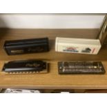 TWO HARMONICAS TO INCLUDE A HOHNER CROSS HARP MS IN KEY F AND A HOHNER BIG RIVER HARP IN KEY C