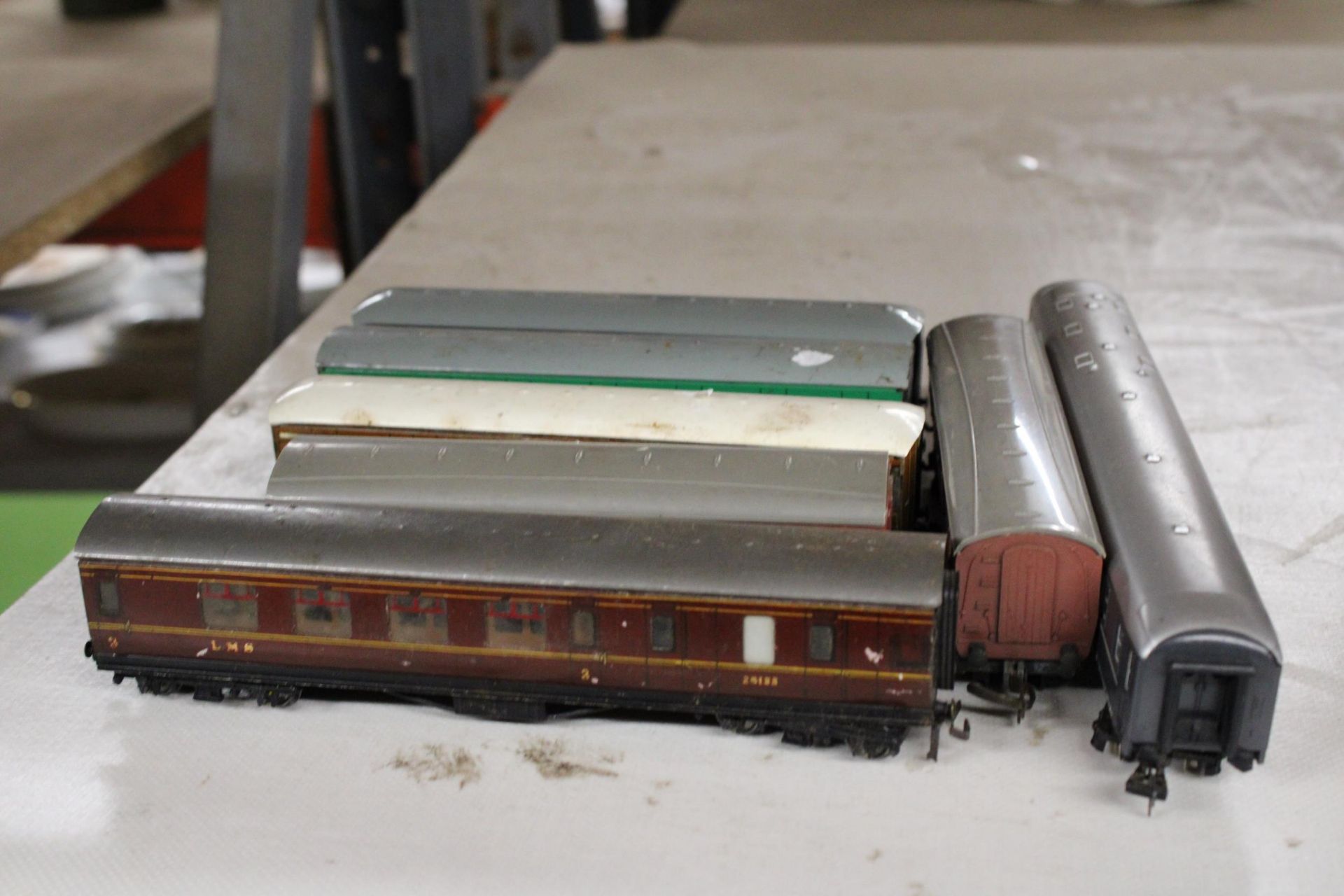 SEVEN EARLY CARRIAGES TO INCLUDE FOUR METAL EXAMPLES