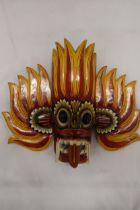 A SRI LANKEN FIRE DEMON TRIBAL MASK