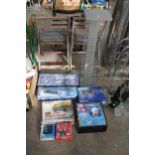 AN ASSORTMENT OF ITEMS TO INCLUDE A TILE CUTTER, A CD RACK AND BOARD GAMES ETC