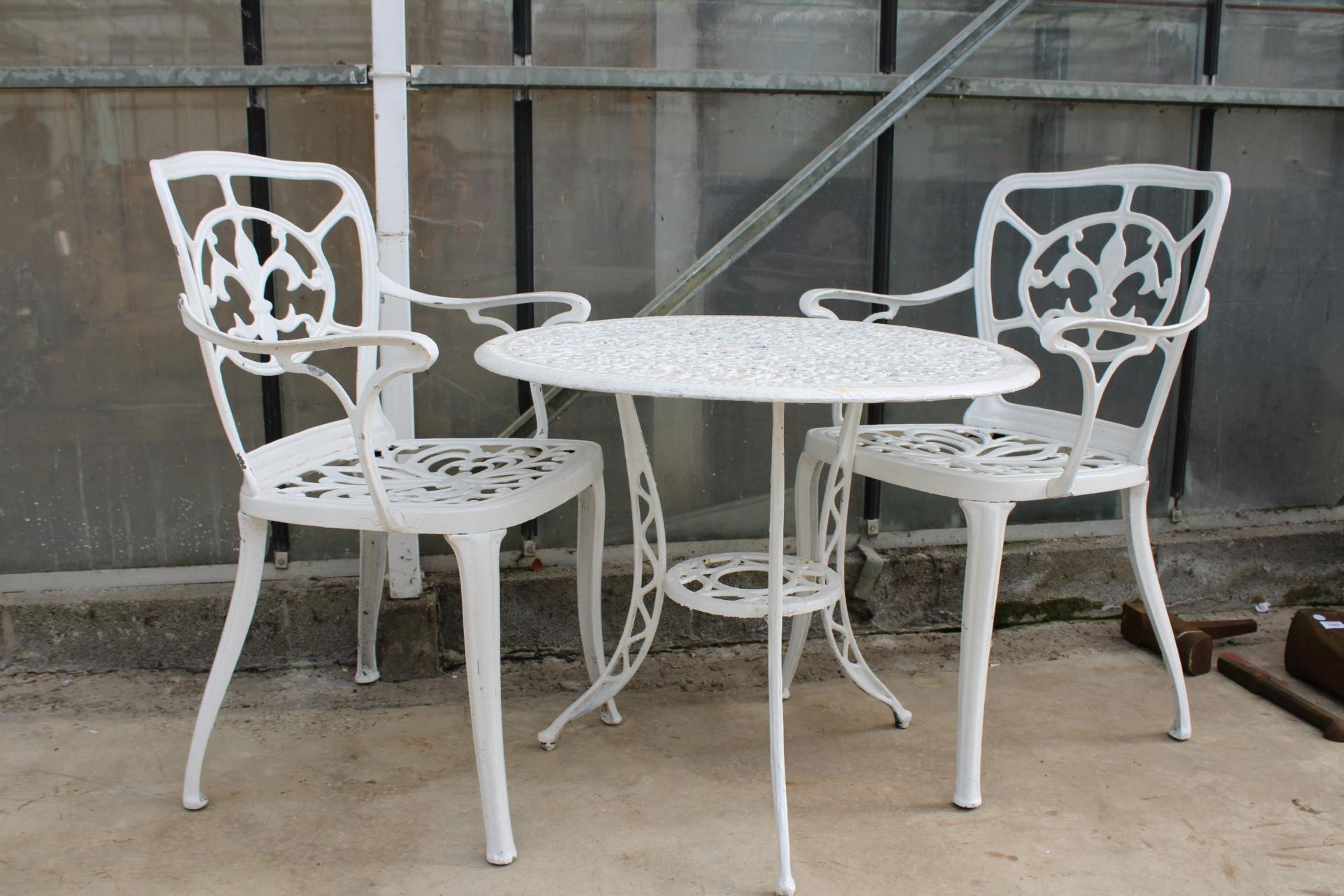 A VINTAGE WHITE CAST ALLOY BISTRO SET COMPRISING OF A ROUND TABLE AND TWO CARVER CHAIRS - Image 2 of 2