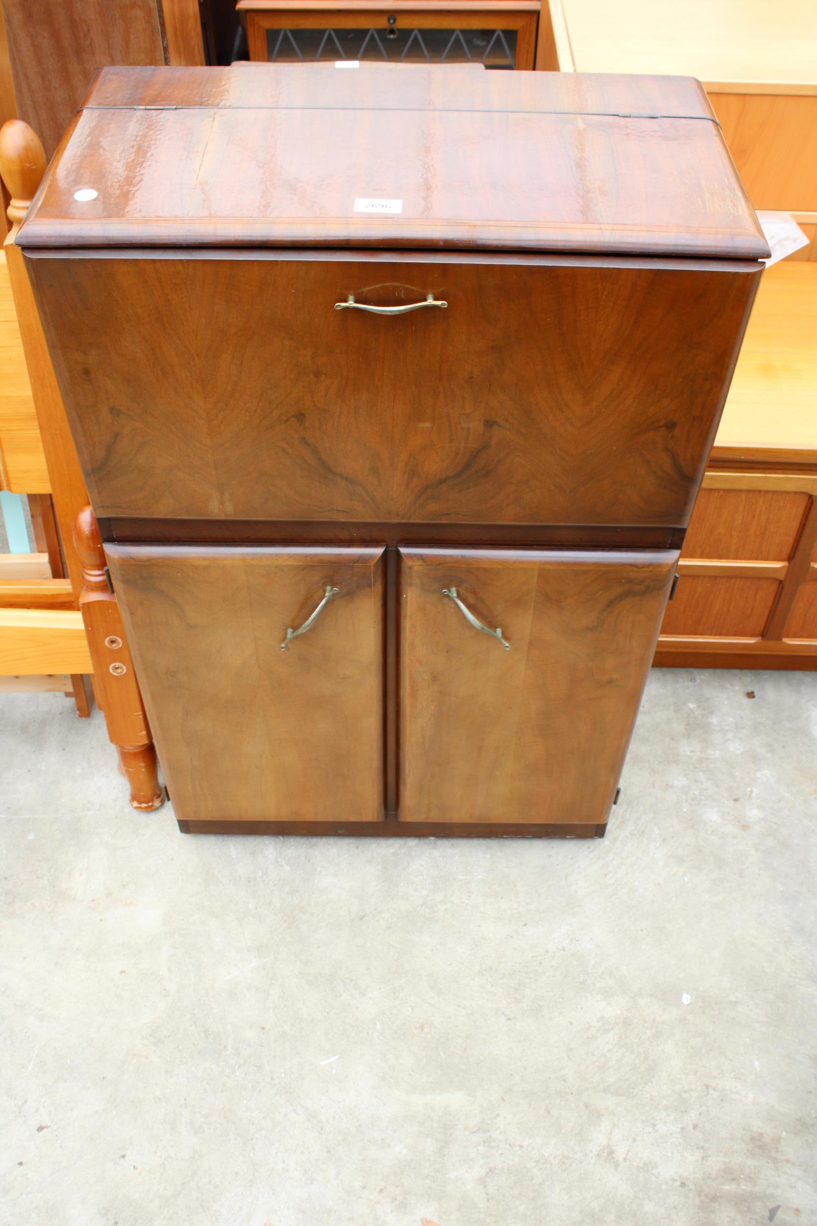 A MID 20TH CENTURY WALNUT COCKTAIL CABINET 24" WIDE
