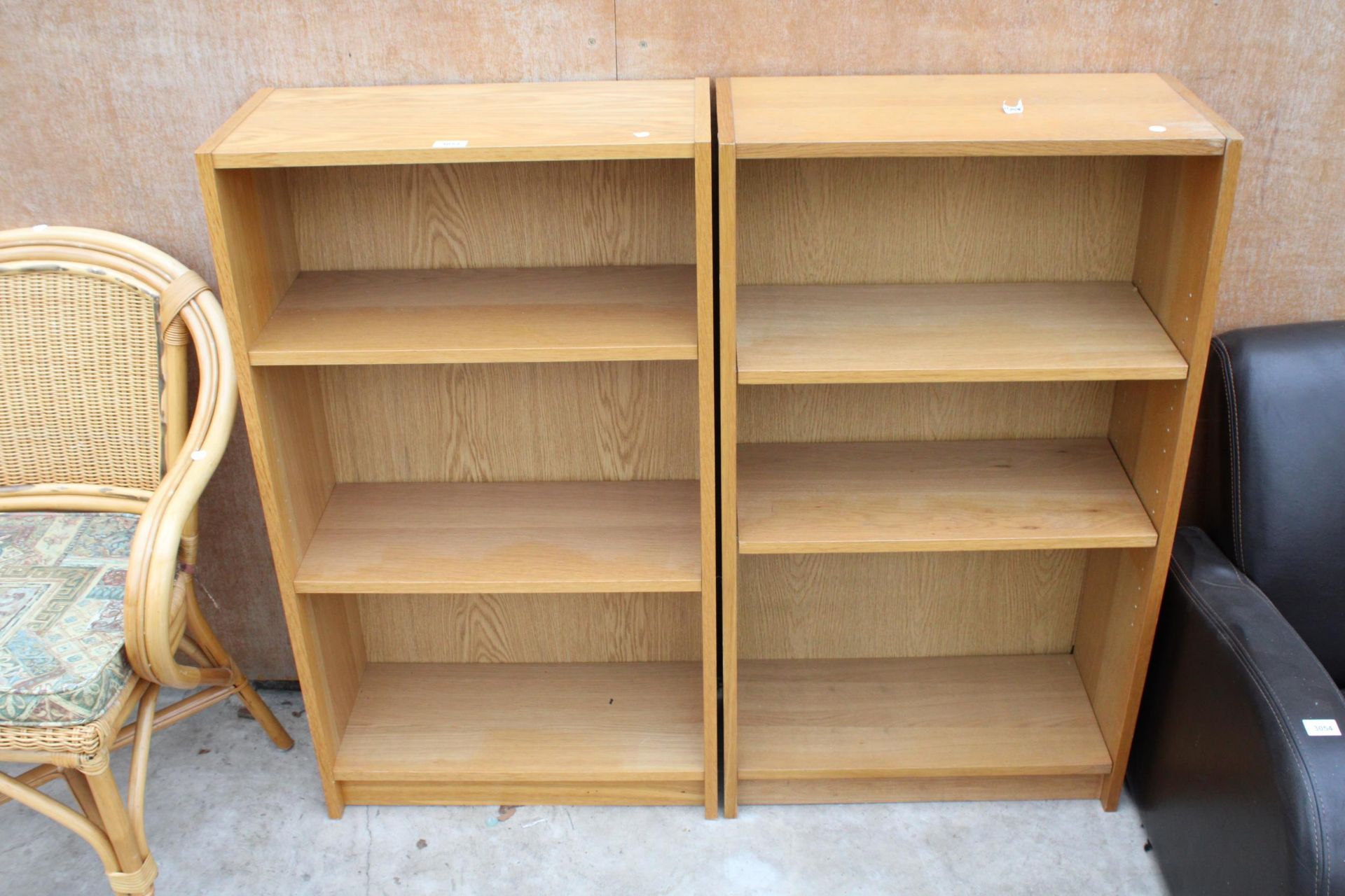 A PAIR OF OAK EFFECT THREE TIER OPEN BOOKSHELVES 24" WIDE EACH