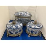 TWO ROCOCO STYLE FOOTED TEA CADDYS WITH ACORN FINIALS AND A FURTHER MATCHING LIDDED ITEM POSSIBLY