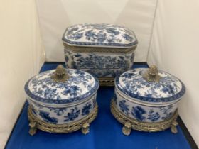 TWO ROCOCO STYLE FOOTED TEA CADDYS WITH ACORN FINIALS AND A FURTHER MATCHING LIDDED ITEM POSSIBLY