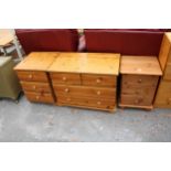 A PINE CHEST OF TWO SHORT AND TWO LONG DRAWERS 31.5" WIDE AND A PAIR OF MATCHING BEDSIDE CHESTS