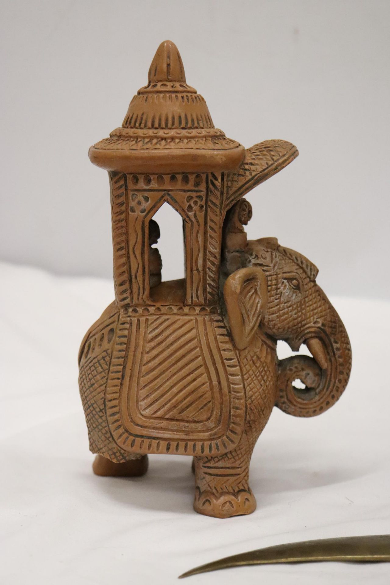 A HARDWOOD CARVED ELEPHANT, STONE ELEPHANT, MISSING A LEG AND A BRASS KNIFE - Image 4 of 12