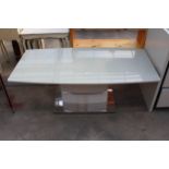 A MILAN STYLE COFFEE TABLE WITH GLASS TOP AND POLISHED CHROME BASE 47" X 24"