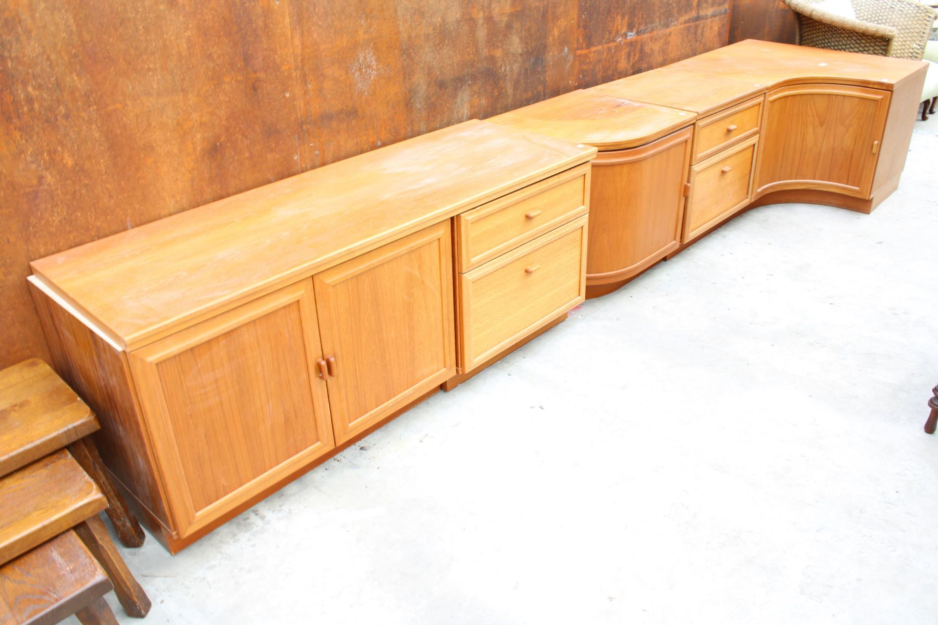 A RANGE OF FOUR RETRO LOW UNITS ENCLOSING CUPBOARDS AND DRAWERS