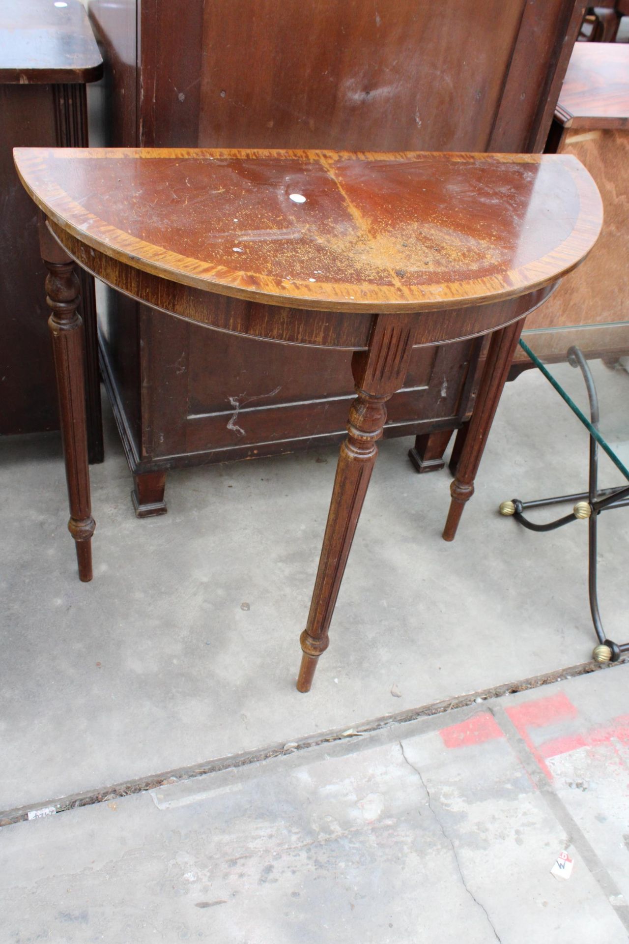 A GLASS TOP COFFEE TABLE ON X FRAME BASE AND A DEMI LUNE HALL TABLE - Image 2 of 3