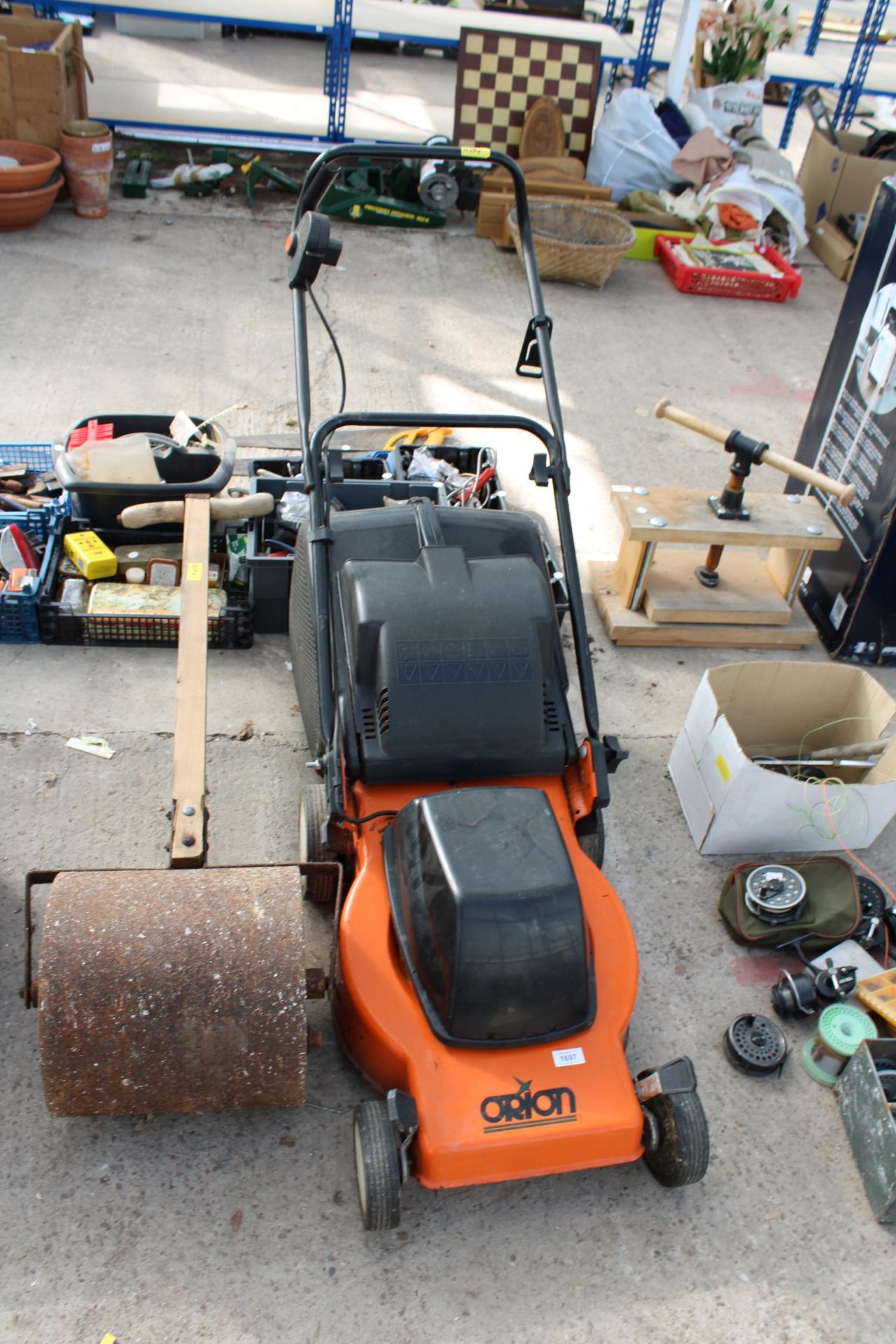 AN ORION ELECTRIC LAWN MOWER AND A SMALL GARDEN ROLLER