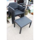FOUR PLASTIC STACKING GARDEN CHAIRS AND A COFFEE TABLE
