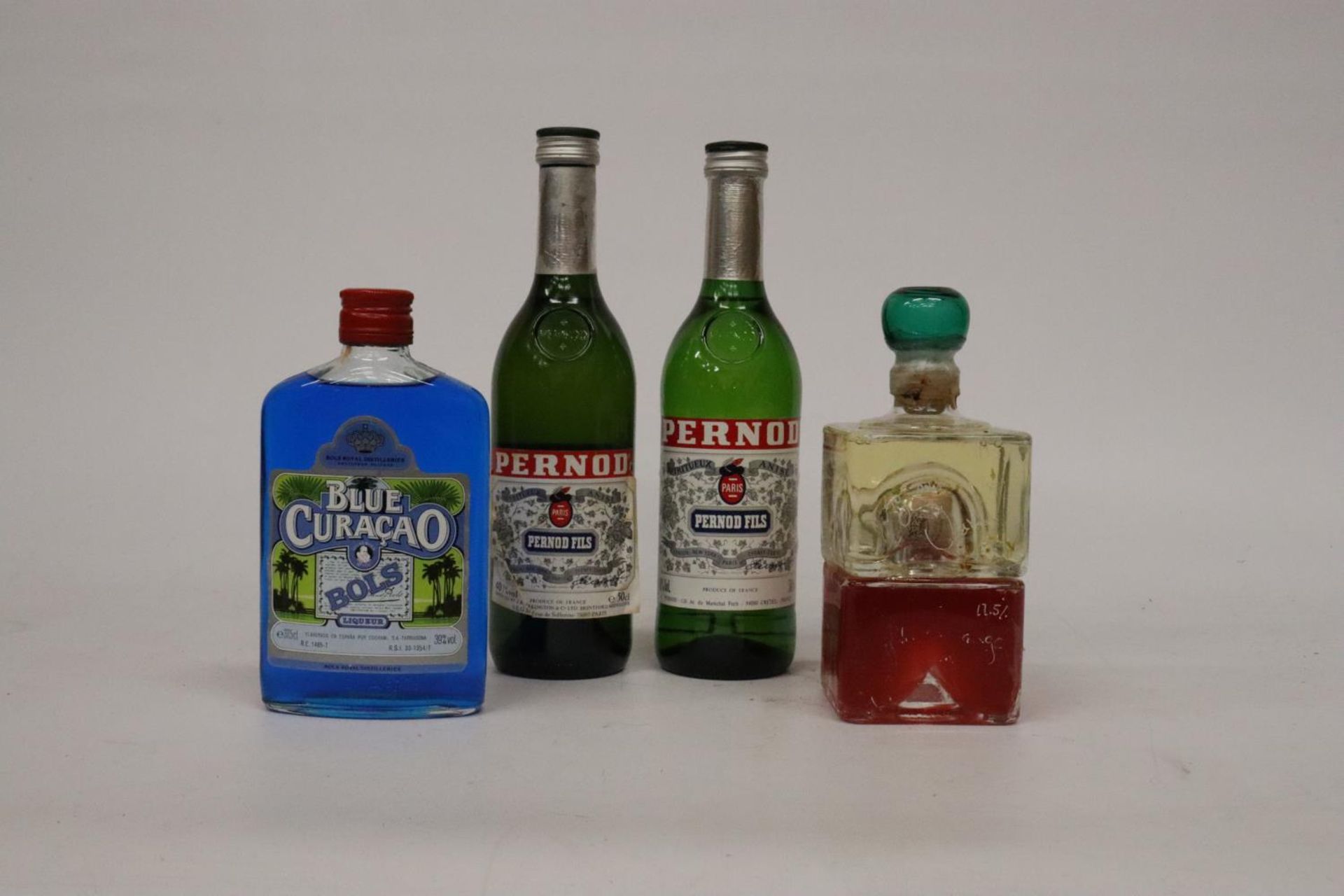 TWO 50CL BOTTLES OF PERNOD FILS, A 37.5CL BOTTLE OF BLUE CURACAO AND A BOTTLE OF - Image 2 of 4