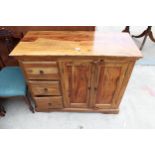 A HARDWOOD SIDEBOARD ENCLOSING THREE DRAWERS AND TWO CUPBOARDS 42" WIDE