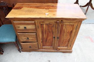A HARDWOOD SIDEBOARD ENCLOSING THREE DRAWERS AND TWO CUPBOARDS 42" WIDE