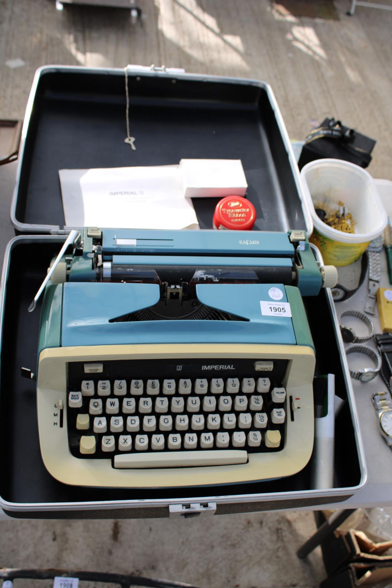 AN IMPERIAL TYPE WRITER WITH A CARRY CASE