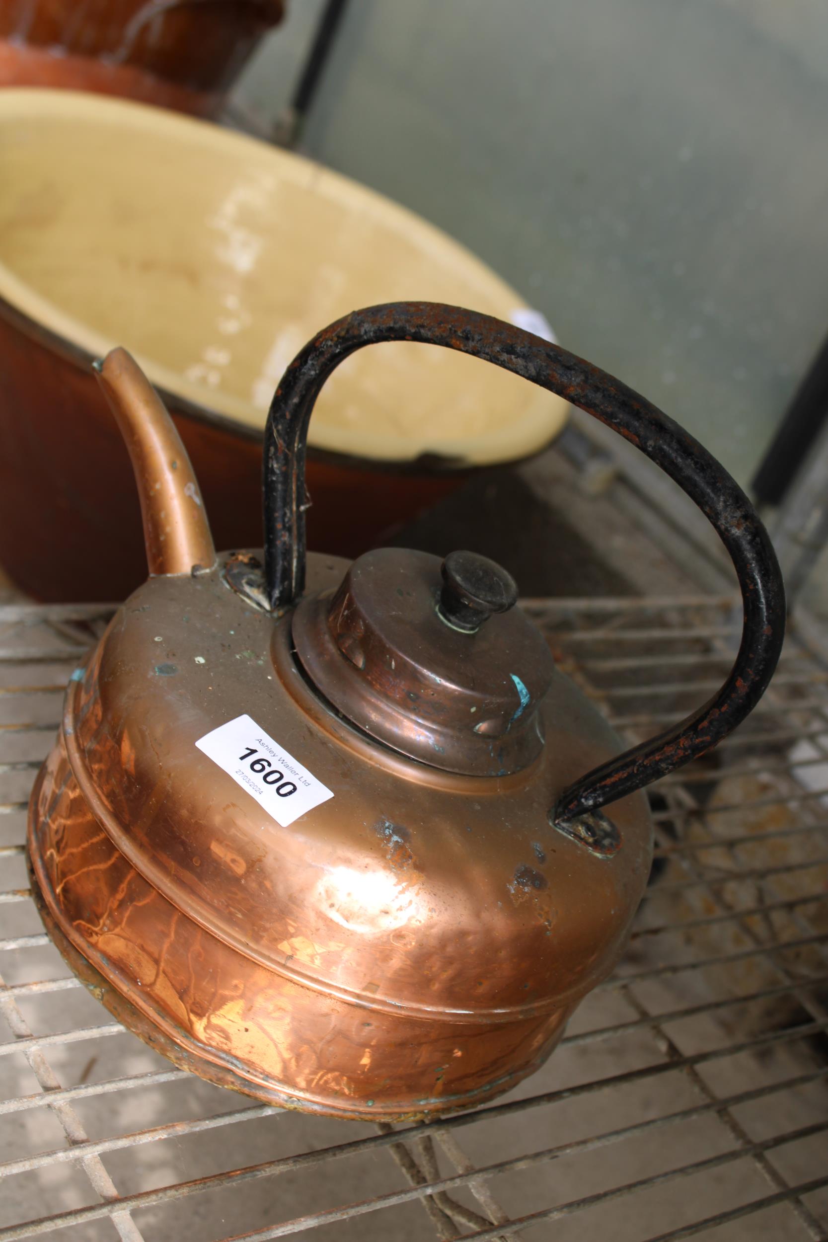 A VINTAGE COPPER KETTLE