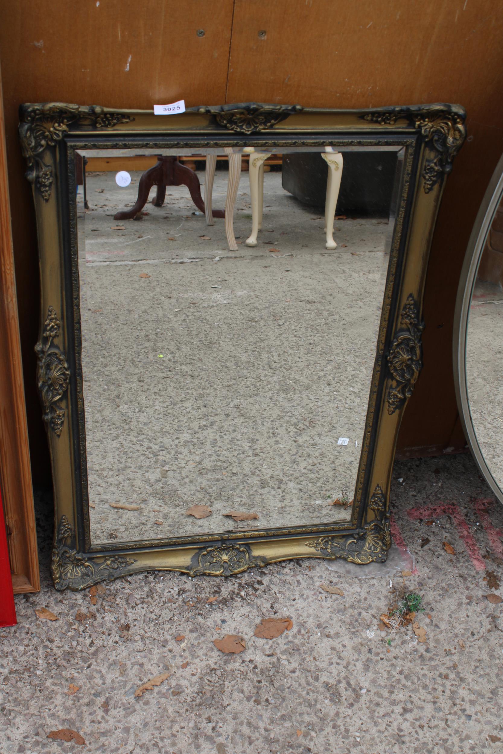 A GILT EFFECT BEVEL EDGE WALL MIRROR 32" X 23"