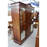 AN EDWARDIAN MAHOGANY AND INLAID DOUBLE MIRROR DOOR WARDROBE 74" WIDE