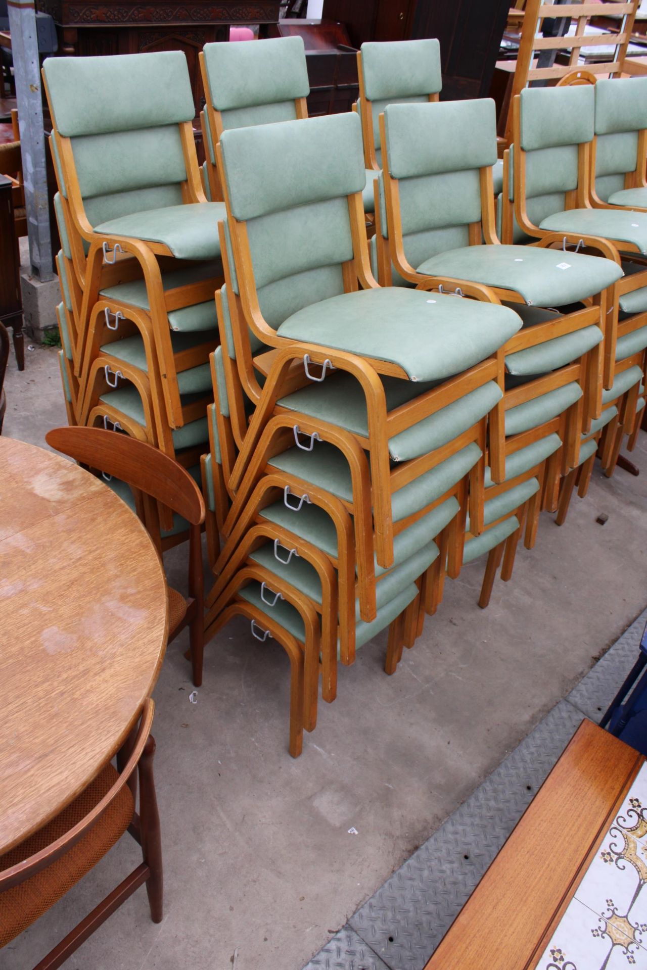 TWENTY FOUR MODERN BENTWOOD STACKING CHAIRS