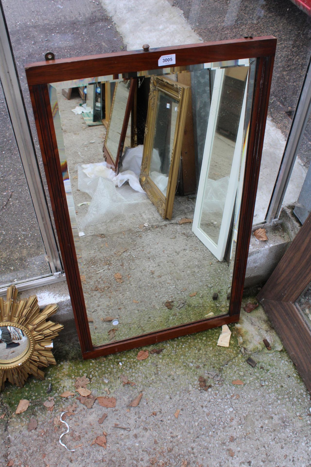 AN EDWARDIAN BEVEL EDGE WALL MIRROR 37" X 22"