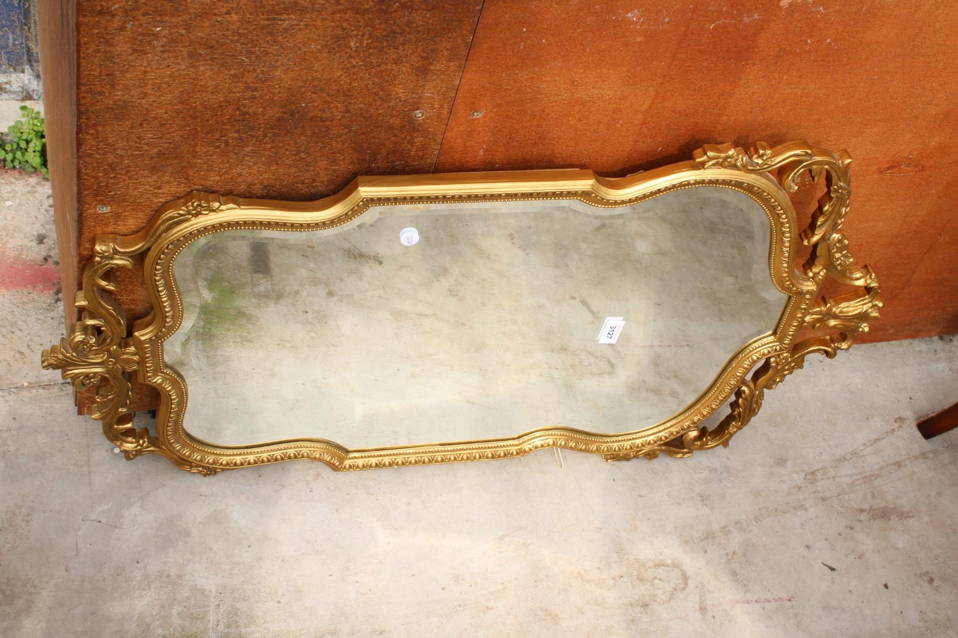 A 19TH CENTURY GILT EFFECT BEVEL EDGE WALL MIRROR, 37" X 21"