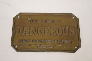 A VINTAGE BRASS PLATE "THIS ANIMAL IS DANGEROUS" DATED 1ST JULY 1862