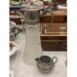 A CUT GLASS CLARET JUG WITH SILVER PLATED TOP AND A SMALL PEWTER JUG