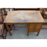 A MID 20TH CENTURY OAK SINGLE PEDESTAL DESK ENCLOSING THREE DRAWERS AND SLIDE 42" X 24"