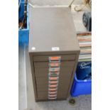 A MINIATURE TEN DRAWER METAL FILING CABINET