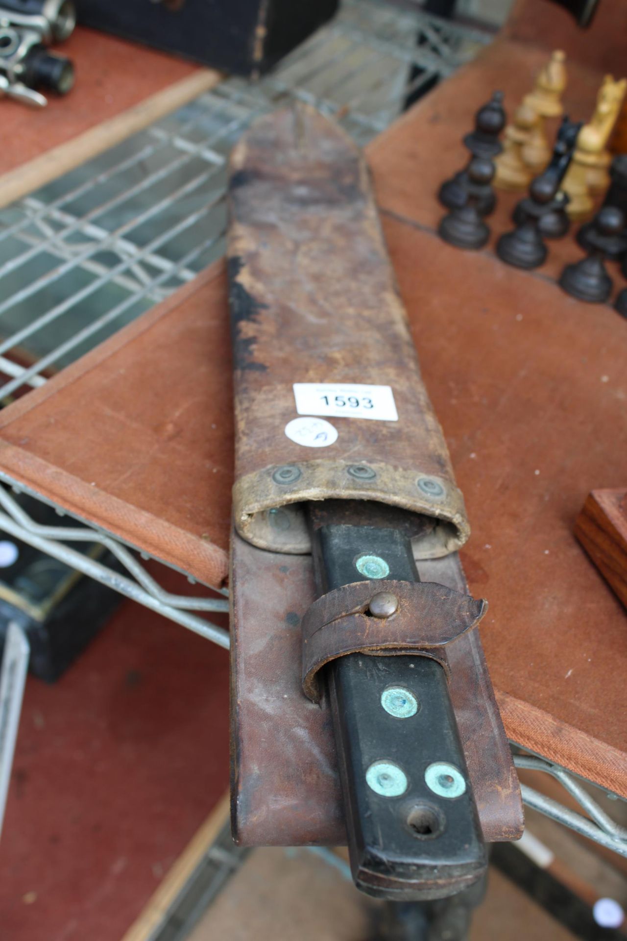 A VINTAGE MACHETTE WITH LEATHER SHEATH