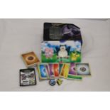 A POKEMON COLLECTORS TIN FULL OF CARDS, STICKERS AND CHARMS
