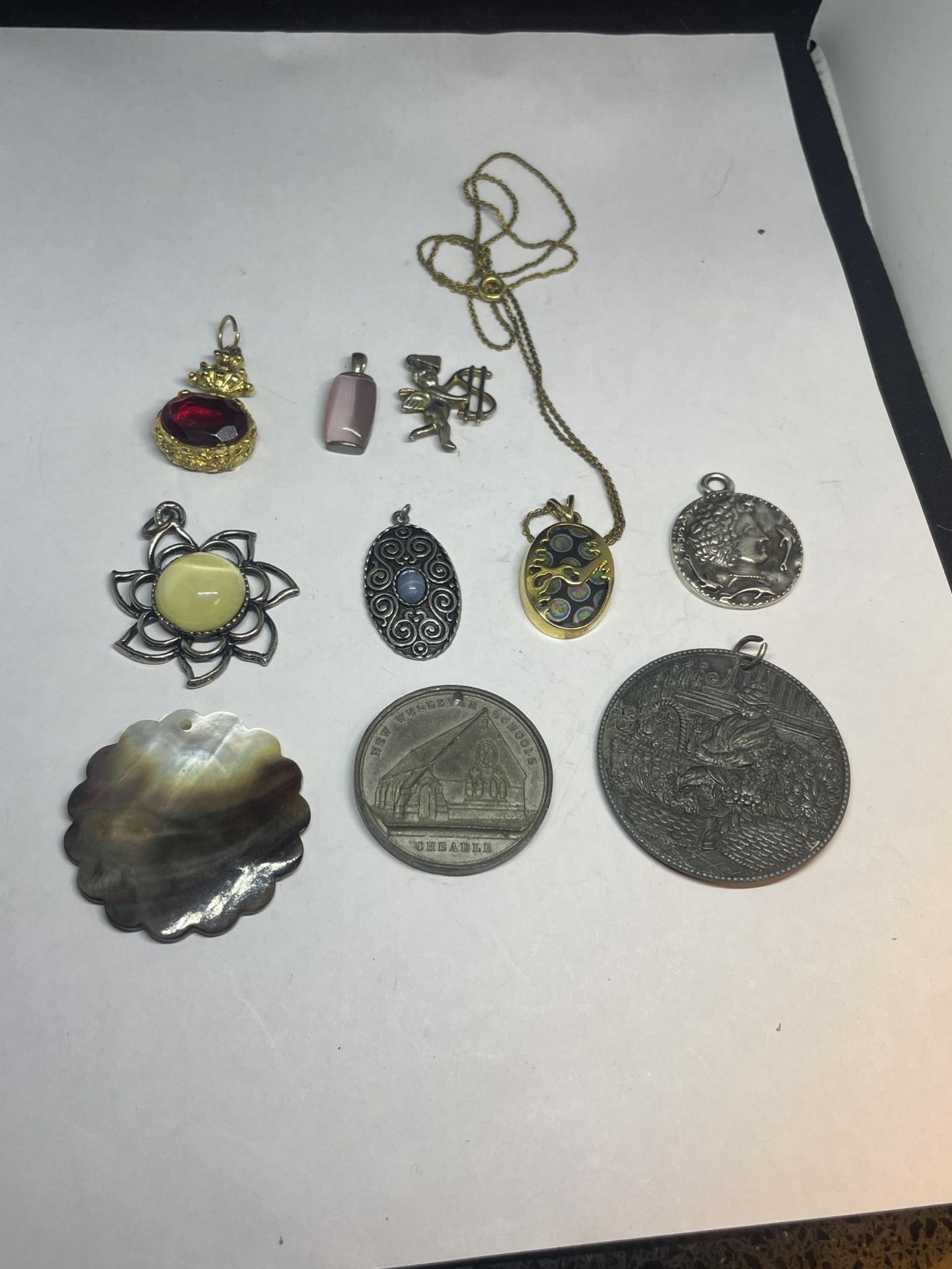 TEN VARIOUS VINTAGE PENDANTS ONE ON A CHAIN