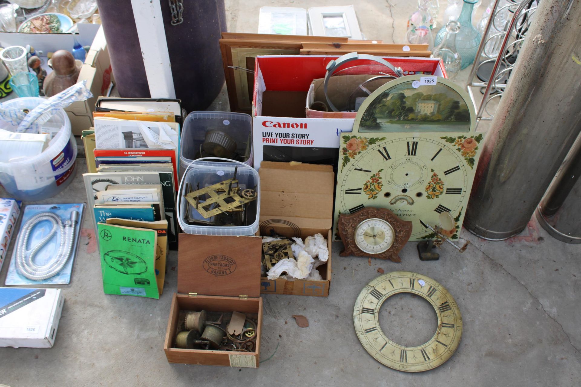 AN ASSORTMENT OF VINTAGE CLOCK PARTS TO INCLUDE FACES, COGS AND BOOKS ON CLOCKS ETC