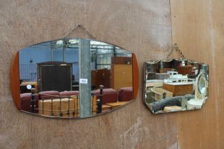 A RETRO WALL MIRROR WITH TEAK EDGES AND A FRAMELESS WALL MIRROR