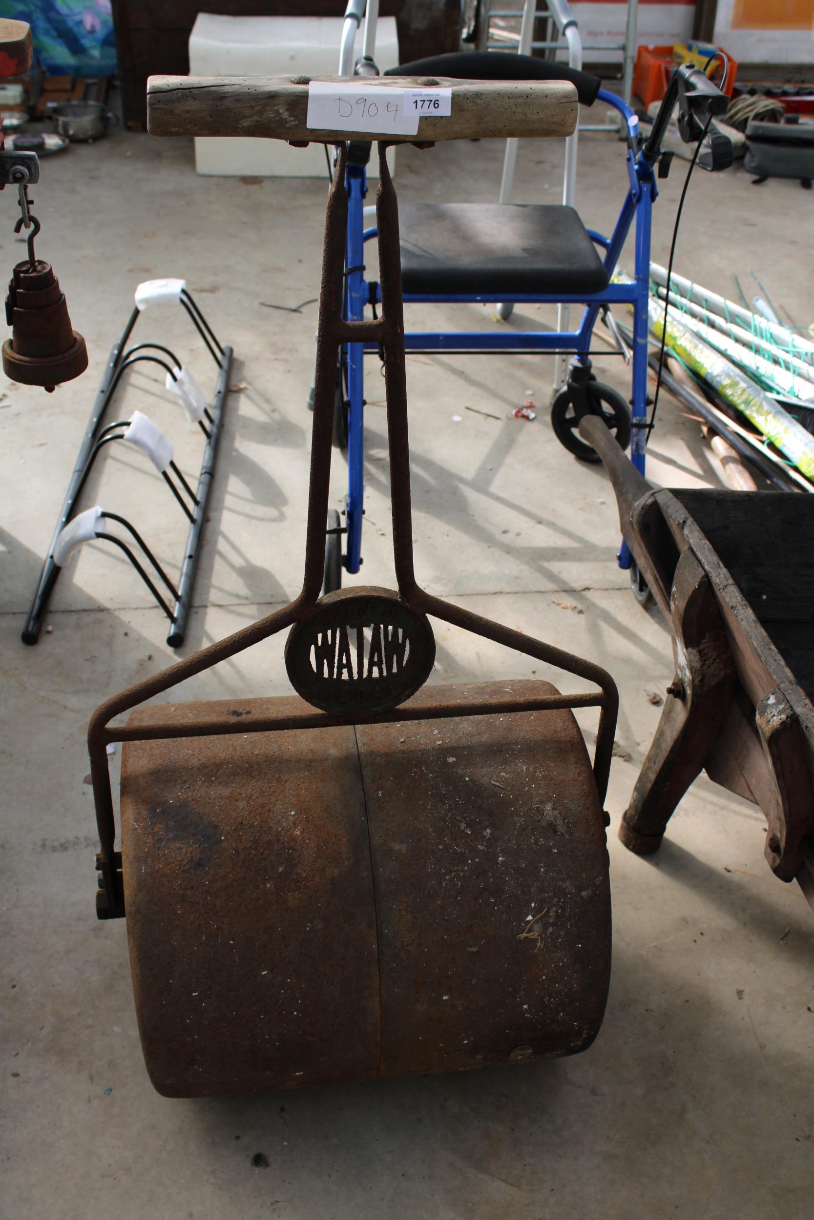 A WATAW VINTAGE CAST IRON GARDEN ROLLER