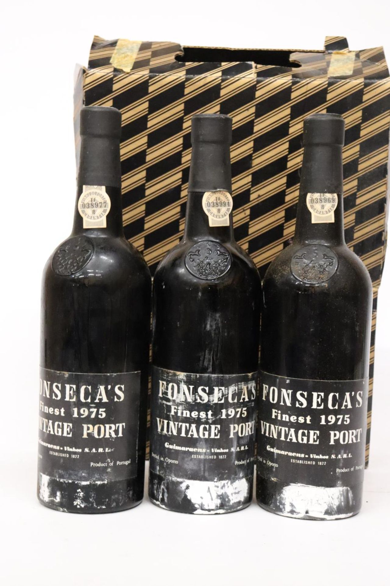 THREE BOTTLES OF FONSECAS 1975 VINTAGE PORT IN A BOX