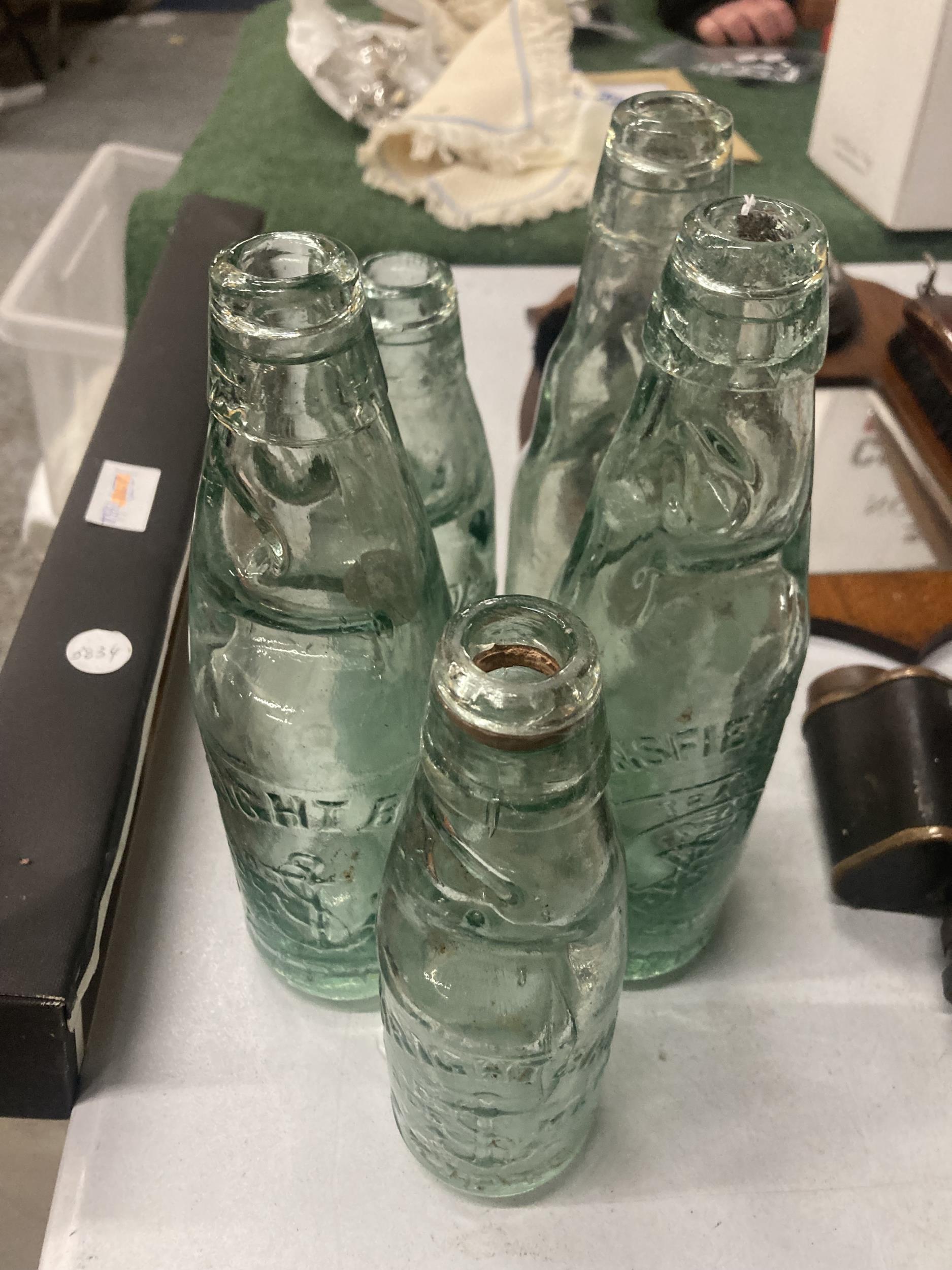 FIVE VINTAGE GLASS COD BOTTLES WITH MARBLE STOPPERS